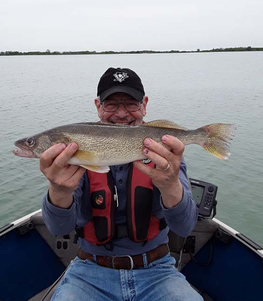 Bill LaVigne holds up a 21-inch walleye he caught from Hurshtown Reservoir.