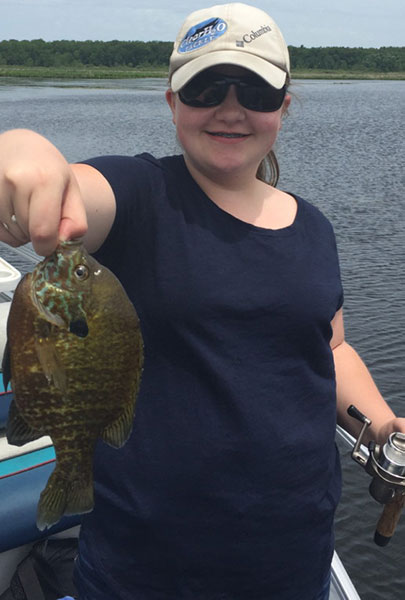 In Michigan, If you catch 25 bluegill like this one caught  by Brooke Schaap, you’ve limited out.  In Indiana, you can keep 100.