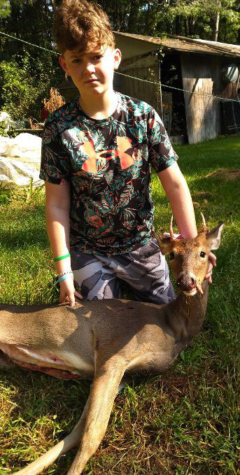 Youngster with deer