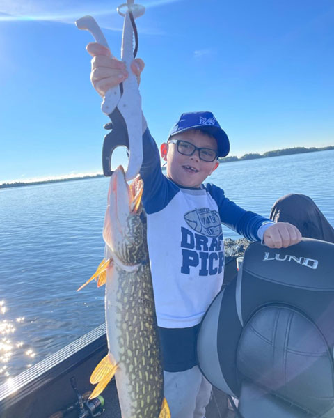 Arlo holding a pike