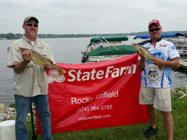 The winners show off a couple of their winning fish.