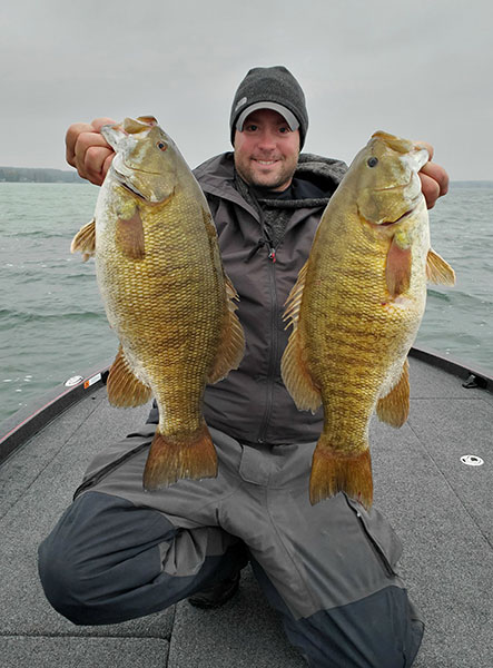 Andrew Lemle with two of his big smallmouth bass
