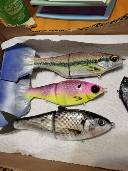 Lures being painted by Wolkins